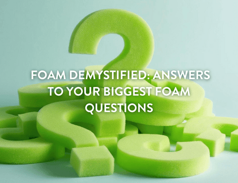 Green custom cut foam Shaped as question marks to indicate the FAQs in the article against a light blue background