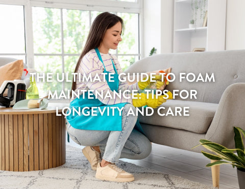 A woman in a blue apron kneels to care for yellow foam on a couch. 
