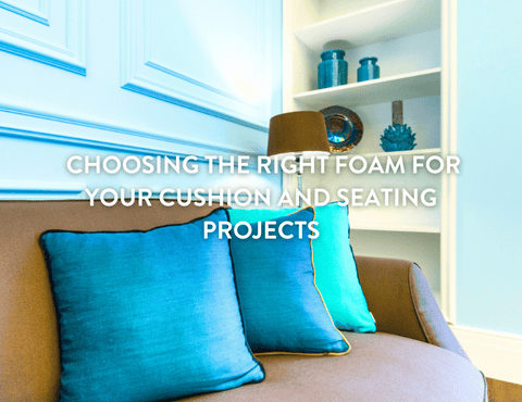 Blue foam cushions on a brown sofa against a light blue Georgian style wall 